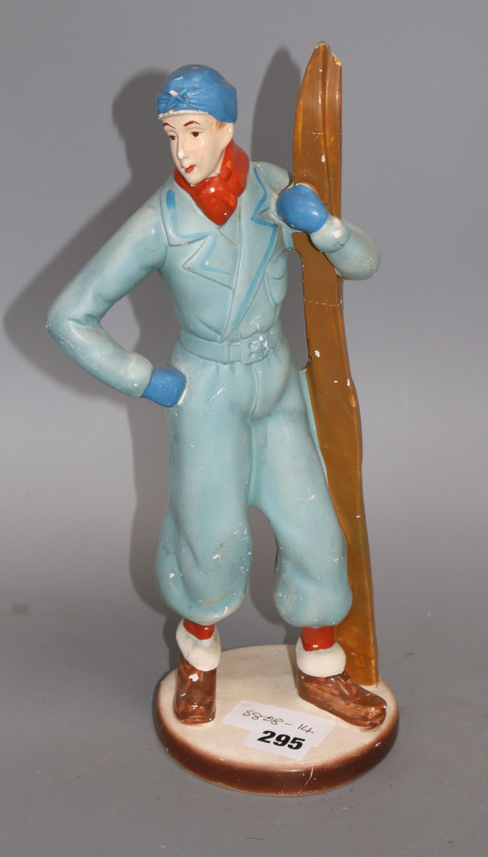 A 1930s painted plaster model of a skier, height 33cm